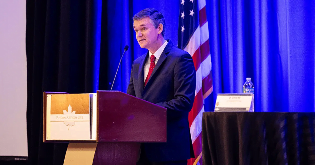 Doug Bush delivering a speech at a POC event