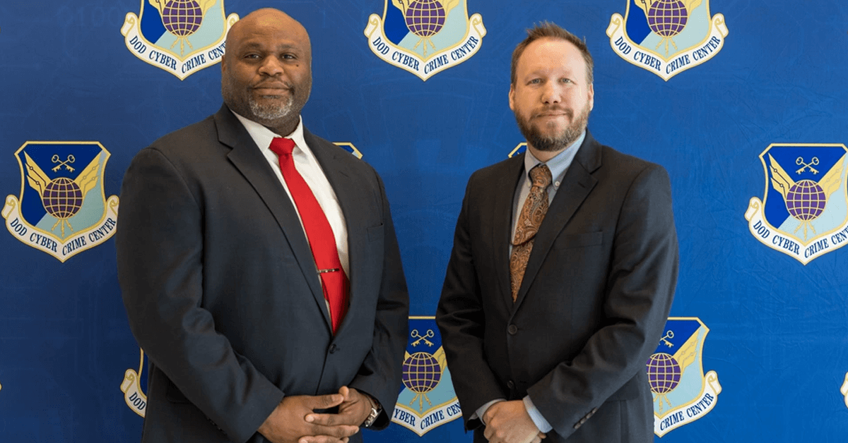 Joshua Black standing beside James Hadley, posing for a picture at the Spring 2023 TechEx