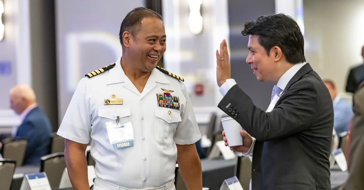 Randy Cruz and GovCon professional. The Navy Research Lab captain networked with guests at the 2026 Navy Summit.